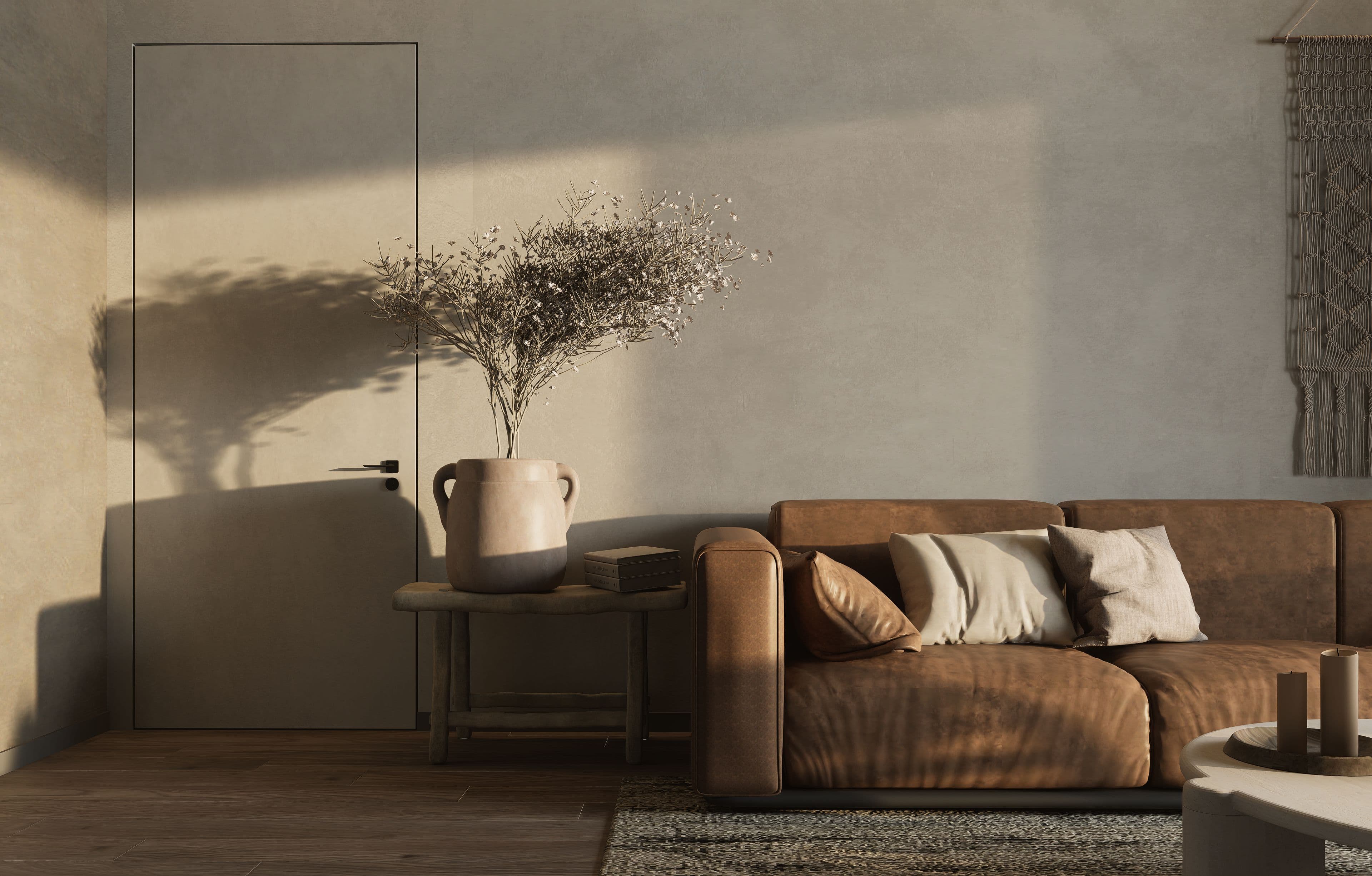 A living room with a sofa in warm natural light